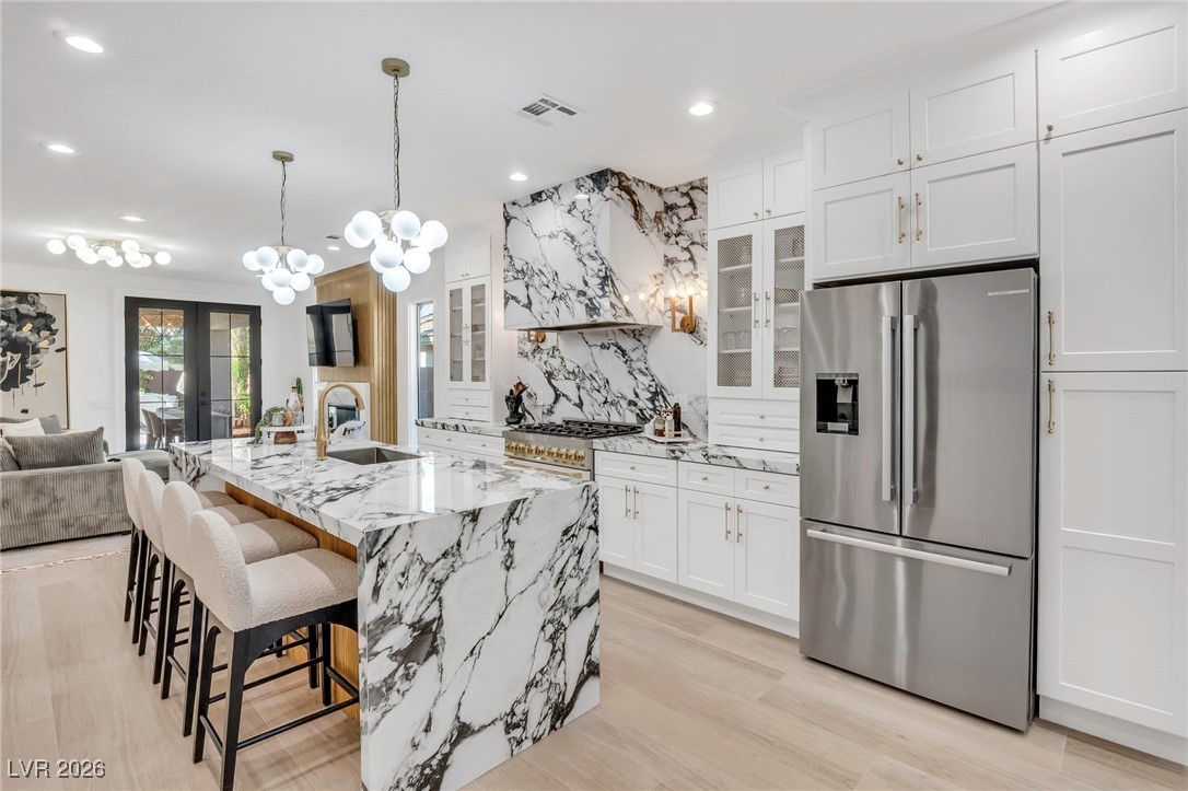 2709 Rue Toulouse Avenue Henderson, NV 89044 - Photo 3 of 43 Large Kitchen with Gas Range and Waterfall Countertops