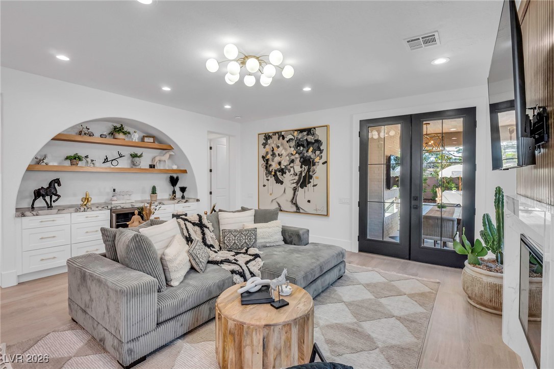 2709 Rue Toulouse Avenue Henderson, NV 89044 - Photo 8 of 43 Living Room with Mini-Bar/Beverage Fridge and Bookcase