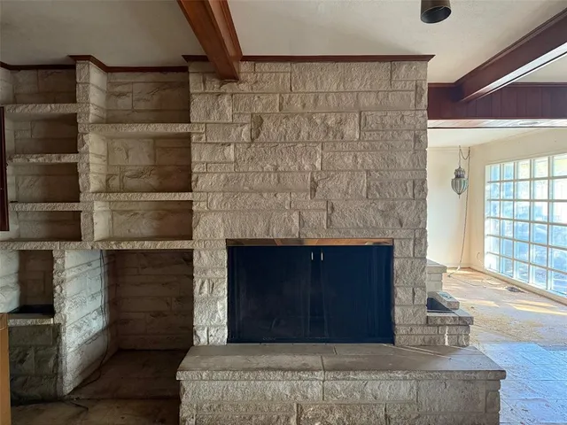 a living room with fireplace