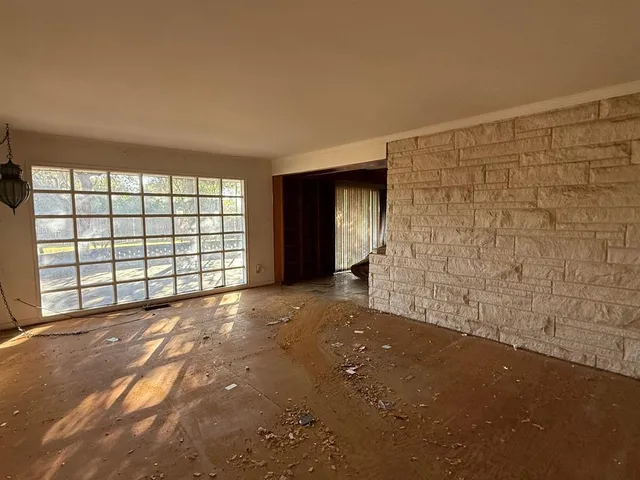 a view of livingroom with an empty space and window