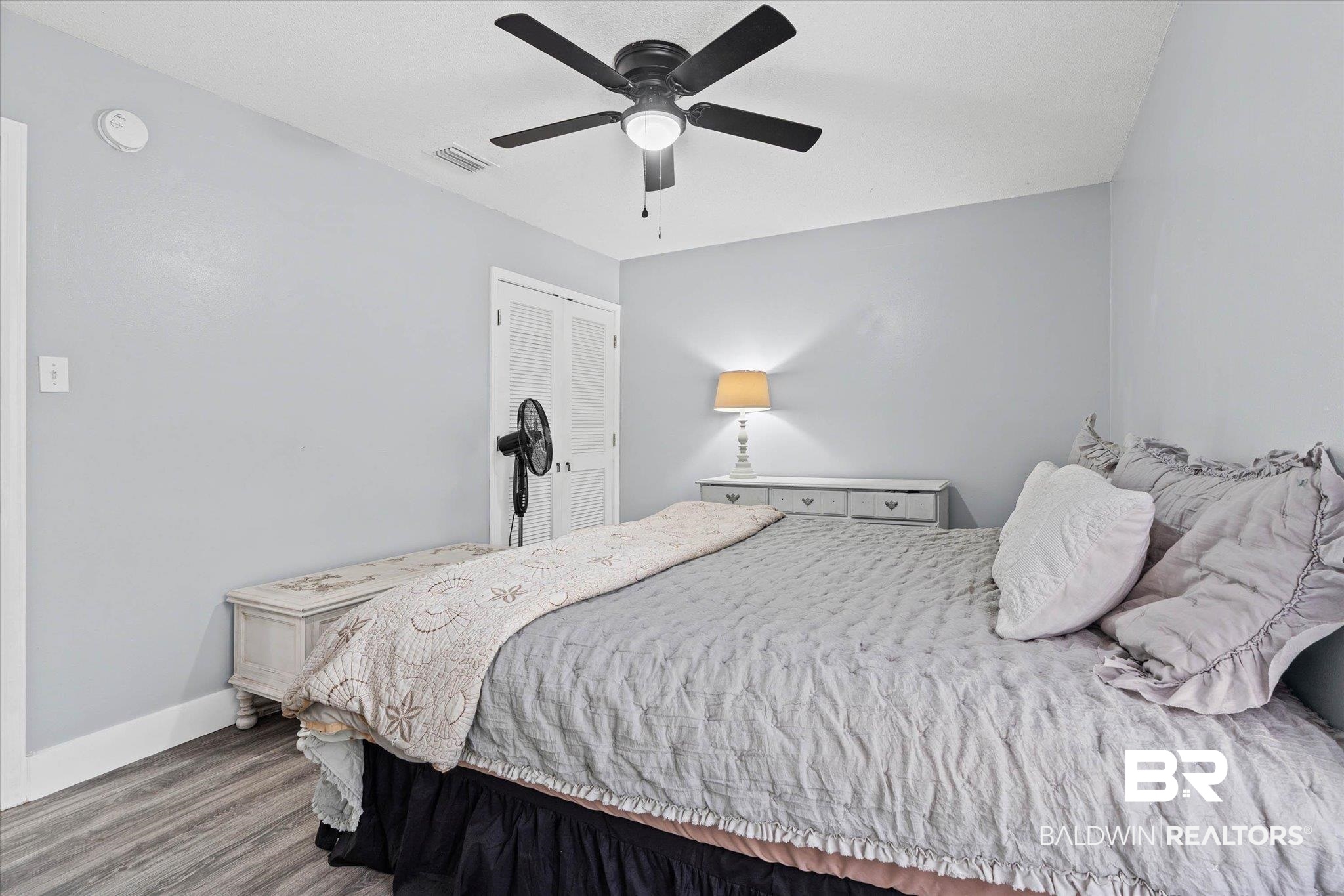 1849 Ranch House Drive Semmes, AL 36575 - Photo 13 of 23 Bedroom featuring wood finished floors, a ceiling fan, and a closet