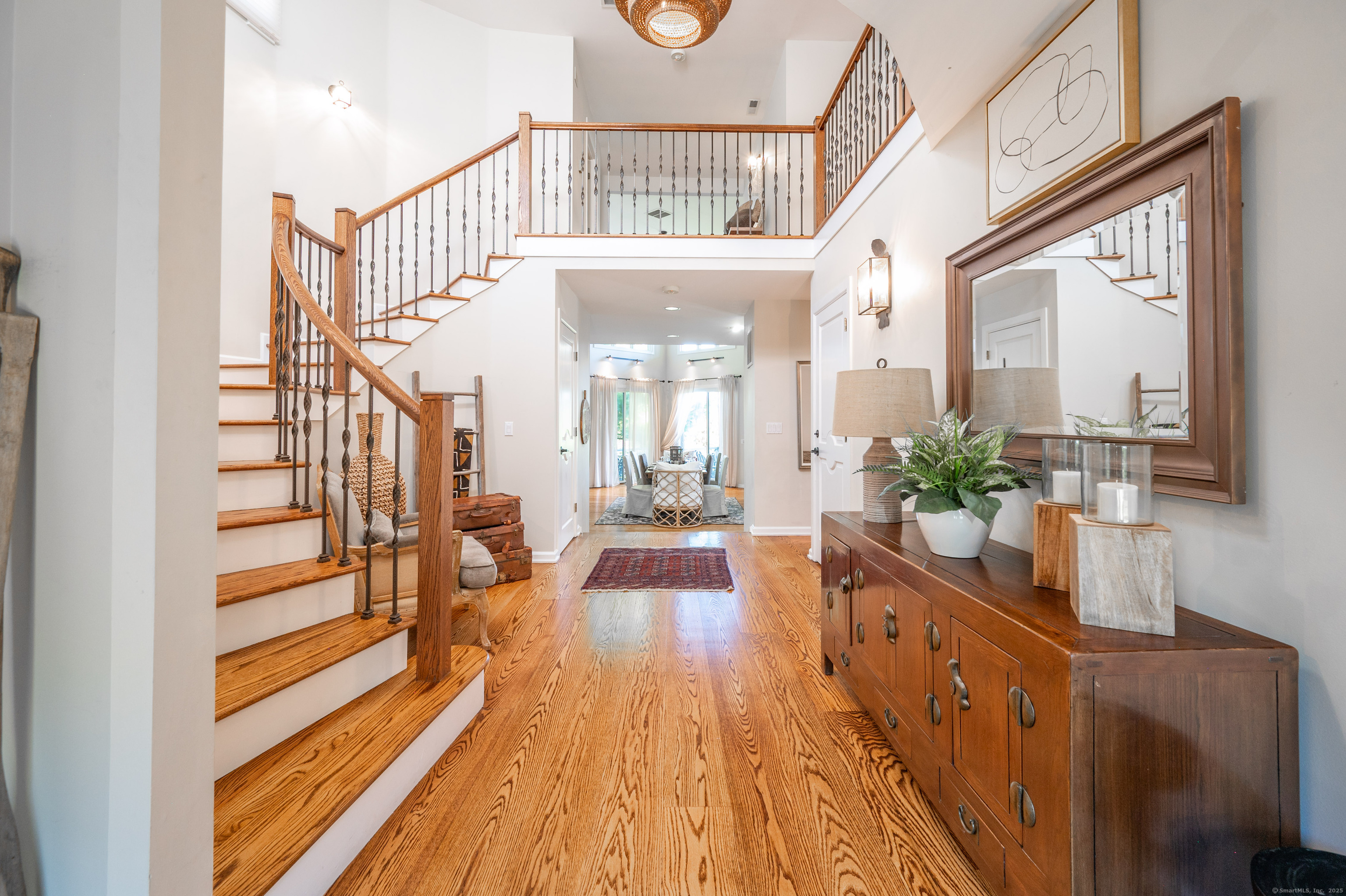 20 Shore Road Danbury, CT 06811 - Photo 1 of 40 a view of a hallway with wooden floor and staircase