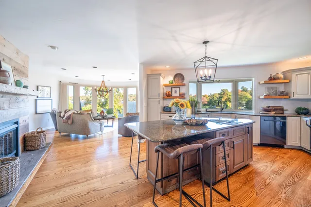 a kitchen with stainless steel appliances granite countertop a stove and more cabinets