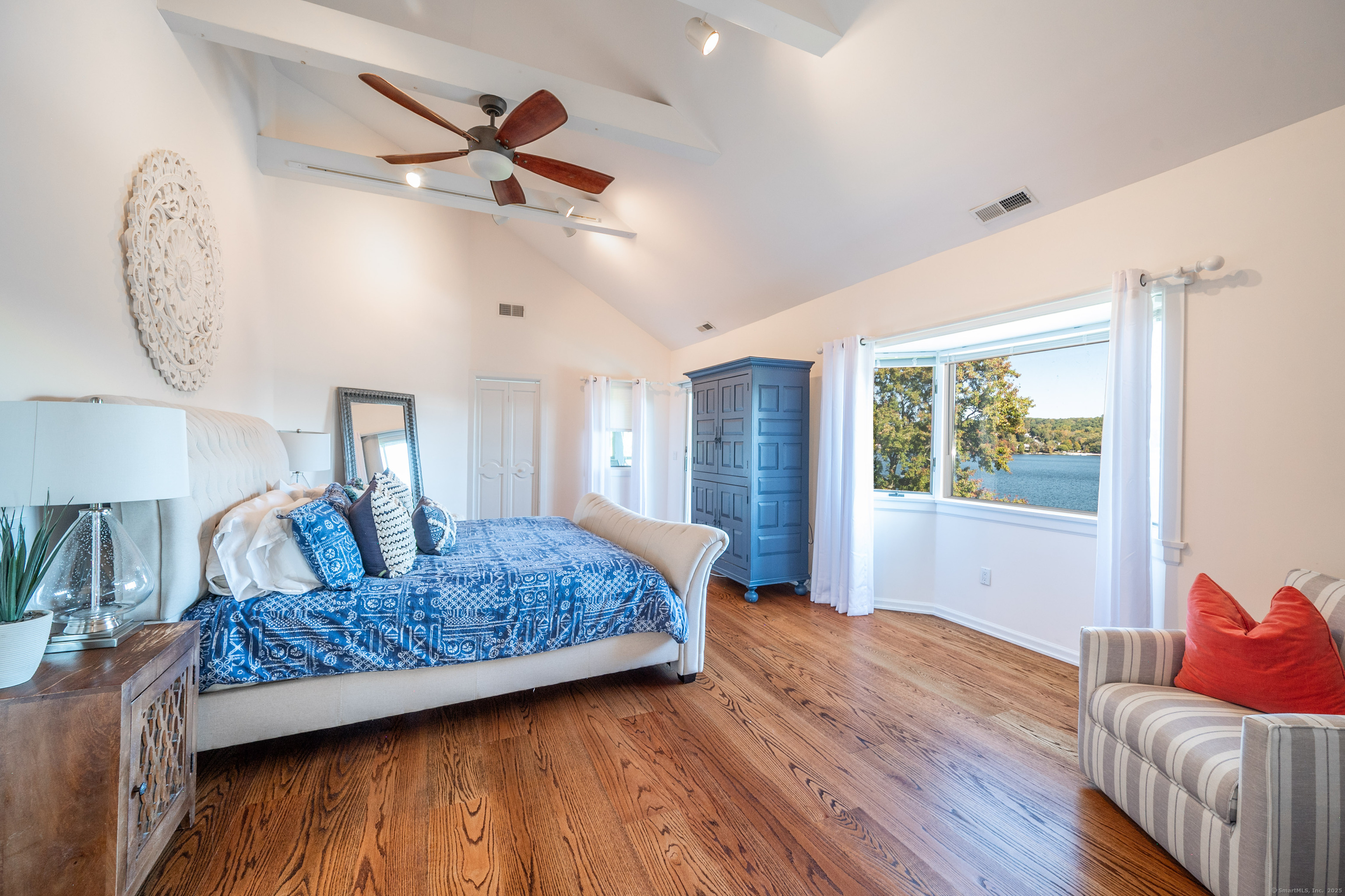 20 Shore Road Danbury, CT 06811 - Photo 21 of 40 a living room with furniture and a chandelier