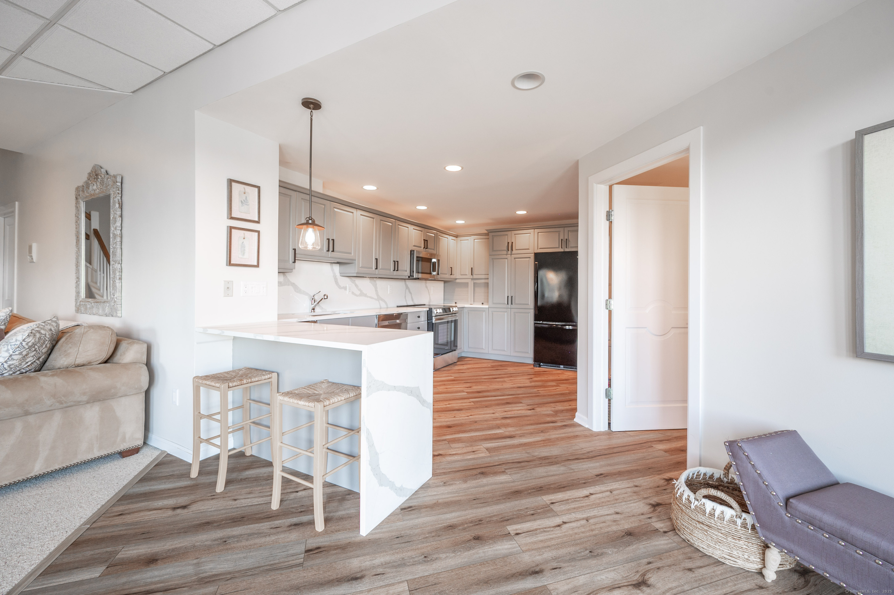 20 Shore Road Danbury, CT 06811 - Photo 25 of 40 a kitchen with stainless steel appliances kitchen island granite countertop a refrigerator and a stove top oven
