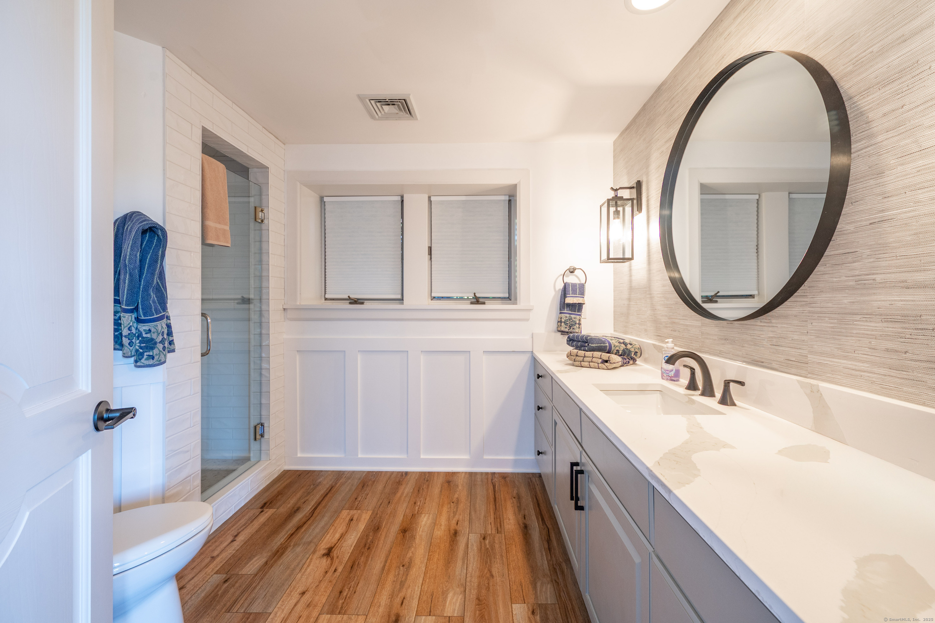 20 Shore Road Danbury, CT 06811 - Photo 32 of 40 a bathroom with a sink and a mirror