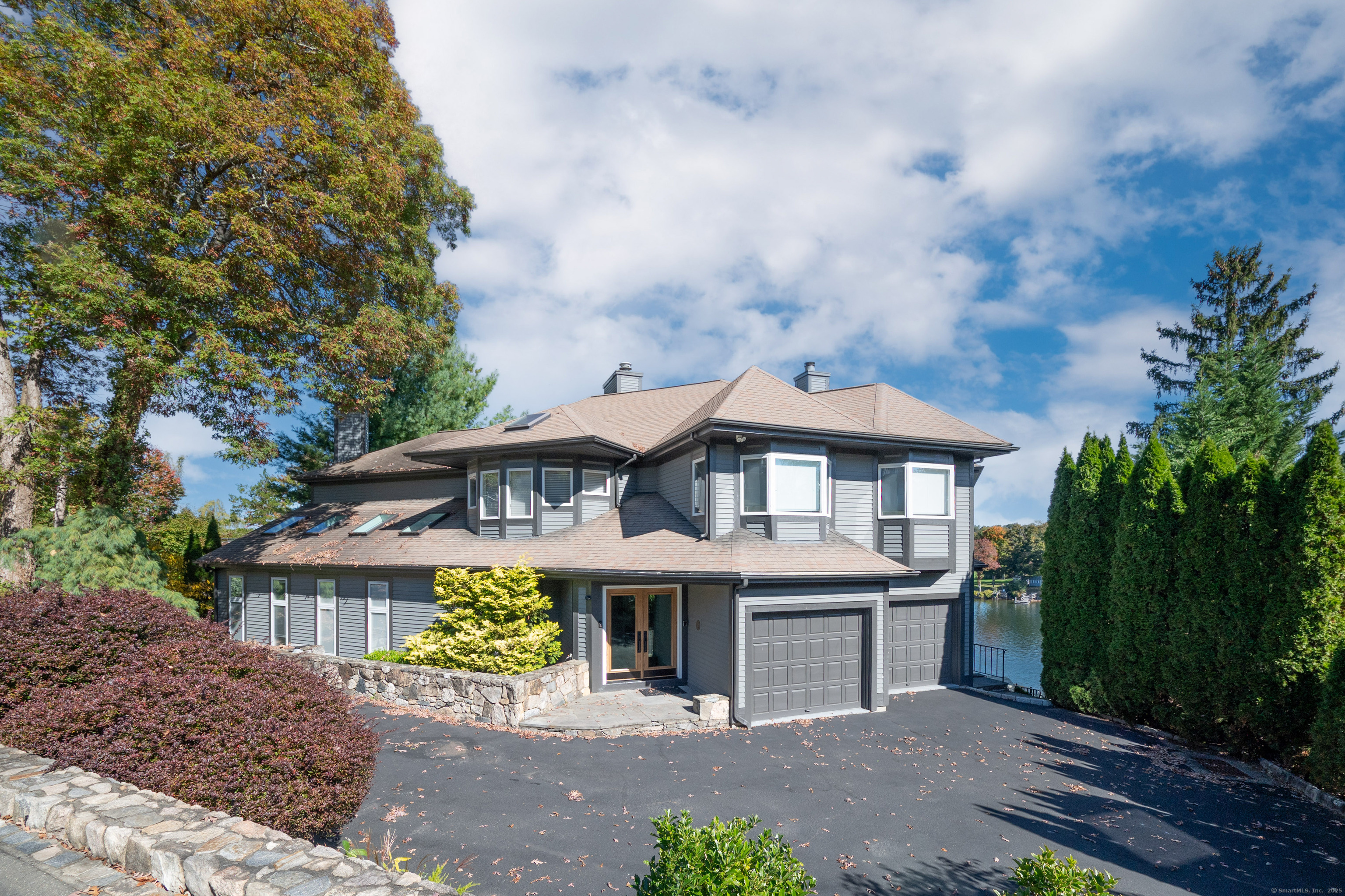 20 Shore Road Danbury, CT 06811 - Photo 37 of 40 a front view of a house with a garden