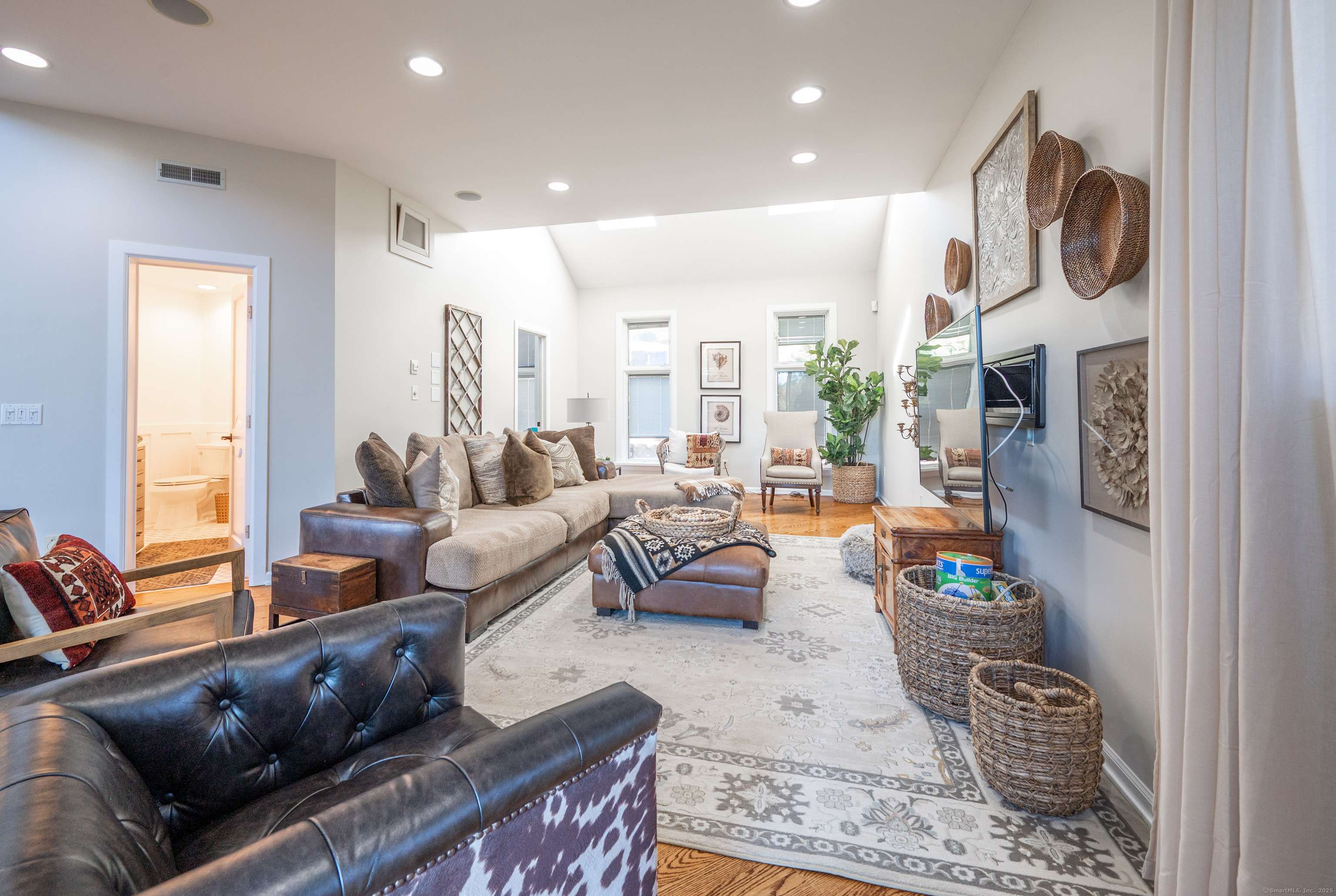 20 Shore Road Danbury, CT 06811 - Photo 4 of 40 a living room with fireplace furniture and a large window