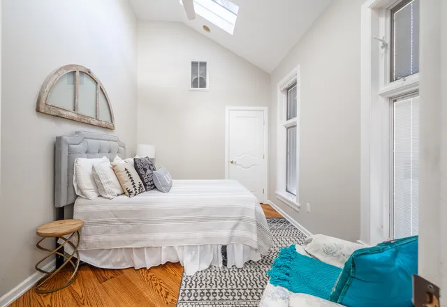 a bedroom with a bed and a cabinets