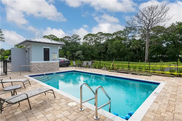 a view of a swimming pool with a lounge chairs
