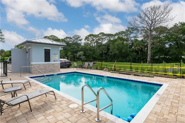 a view of a swimming pool with a lounge chairs