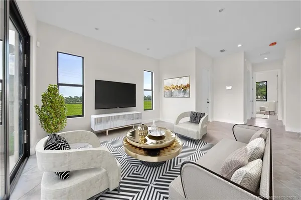 a living room with furniture and a flat screen tv