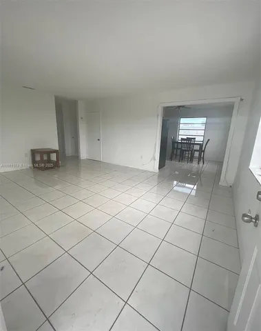 a view of an empty room and utility room