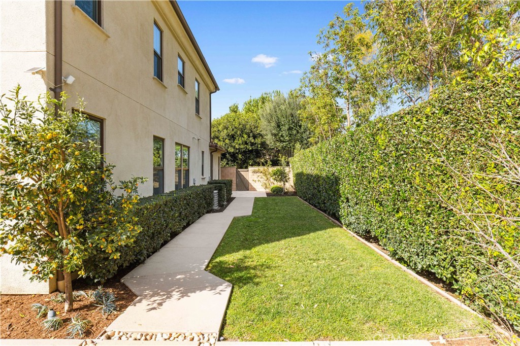 71 Clocktower Irvine, CA 92620 - Photo 57 of 73 The side courtyard provides the ground-floor suite with its own outdoor leisure space.