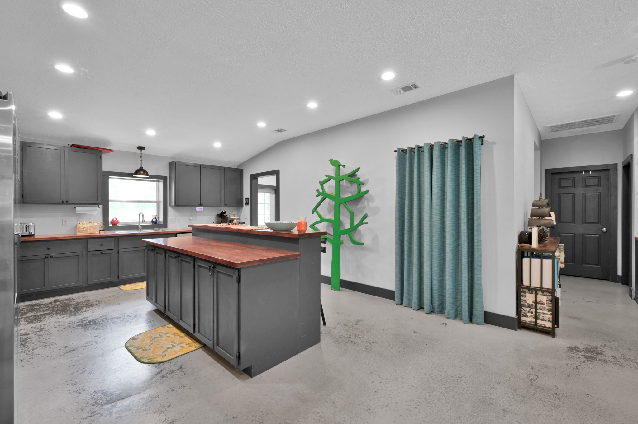 315 Cessna Road Trinity, TX 75862 - Photo 14 of 37 a kitchen with stainless steel appliances granite countertop a stove a sink and a refrigerator