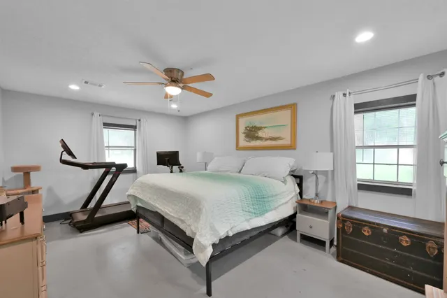 a bathroom with a sink vanity tub and a mirror