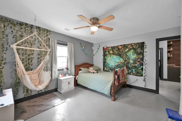 a view of a chair in the deck of a house