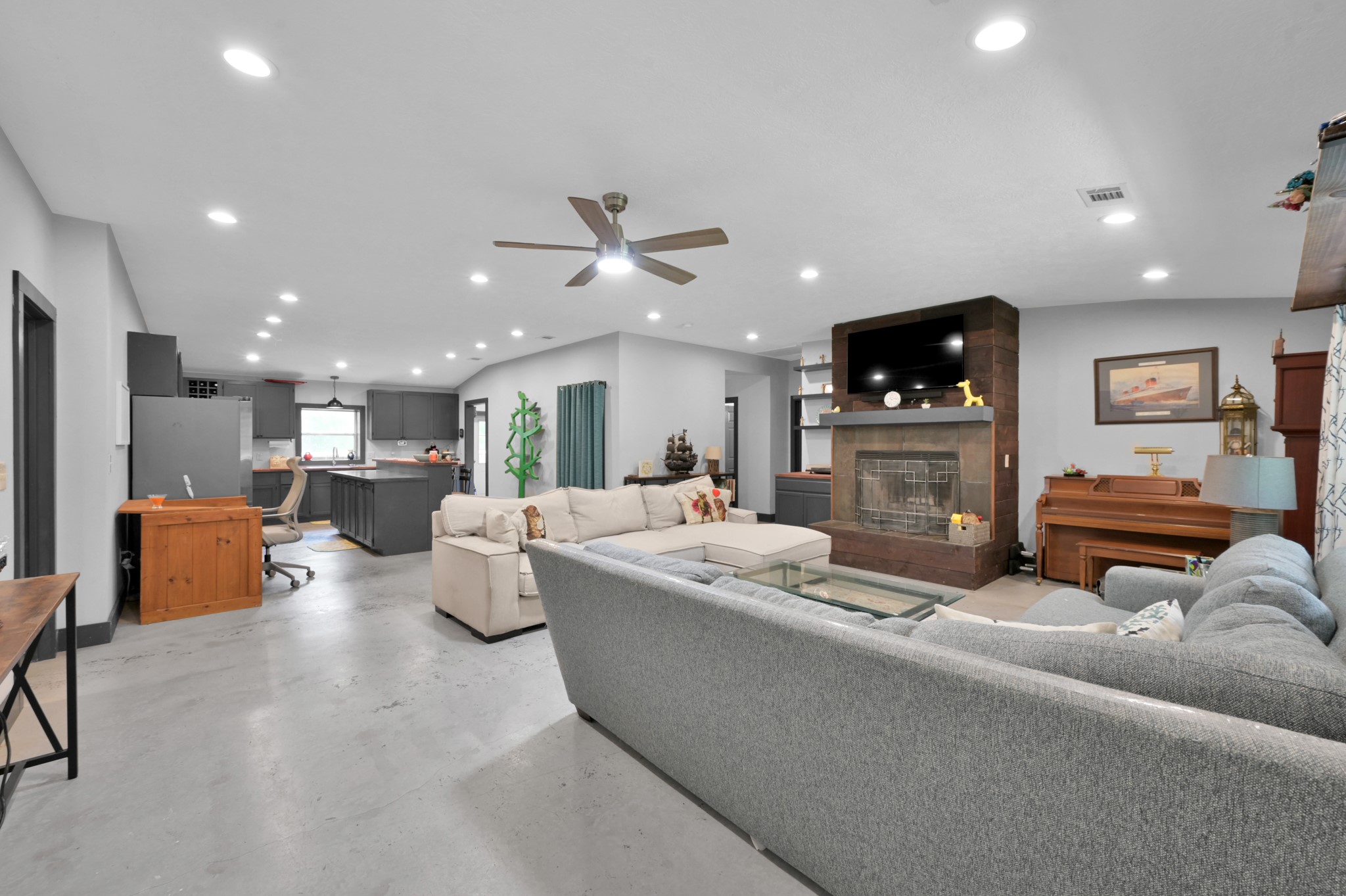 315 Cessna Road Trinity, TX 75862 - Photo 9 of 37 a living room with furniture kitchen view and a flat screen tv