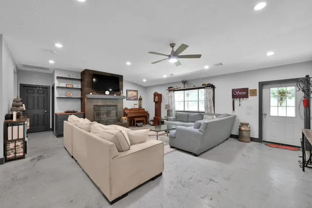 a living room with furniture and a window