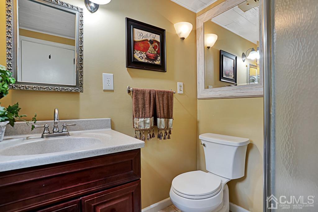 3 Blue Ridge Avenue Green Brook, NJ 08812 - Photo 11 of 30 a bathroom with a sink mirror and toilet