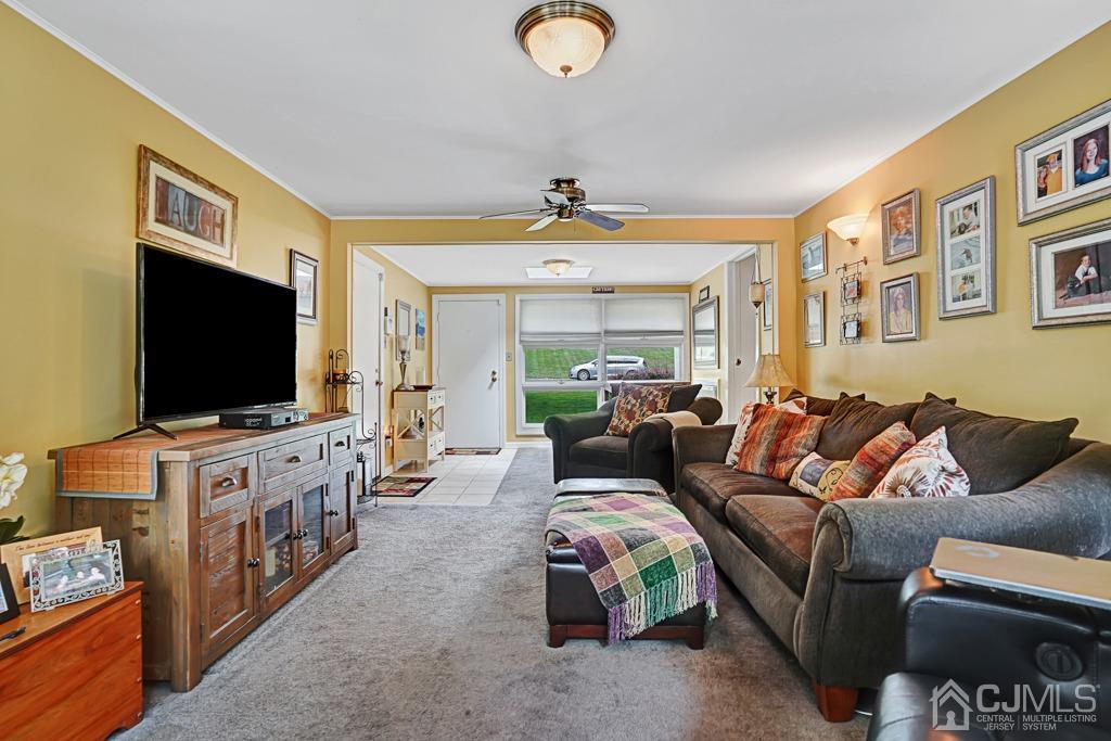 3 Blue Ridge Avenue Green Brook, NJ 08812 - Photo 12 of 30 a living room with furniture and a flat screen tv