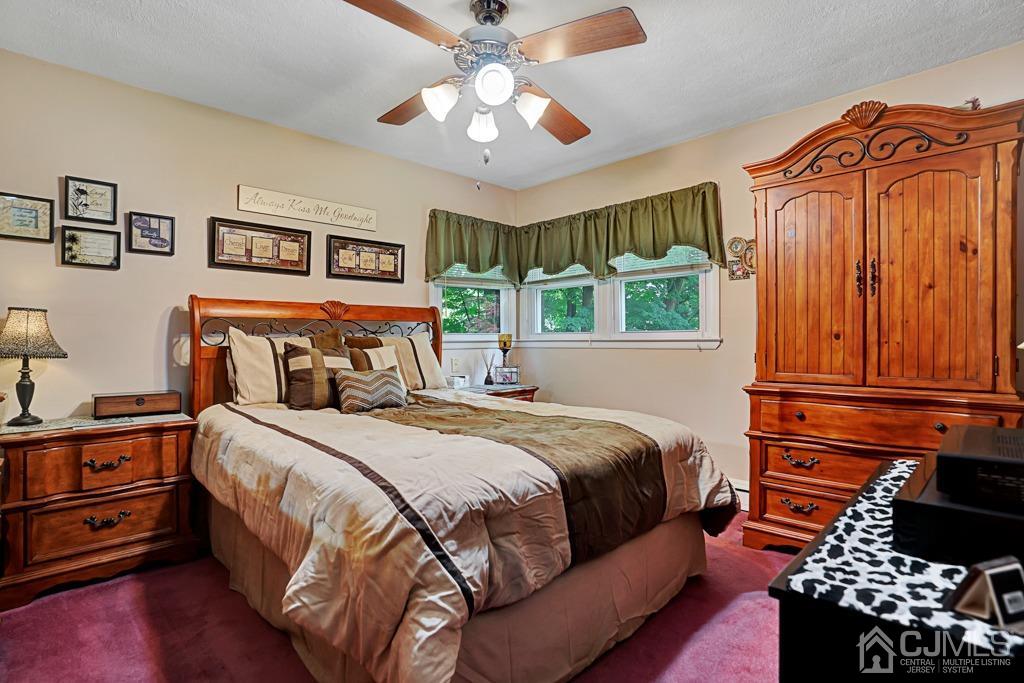 3 Blue Ridge Avenue Green Brook, NJ 08812 - Photo 14 of 30 a bedroom with bed and wooden floor