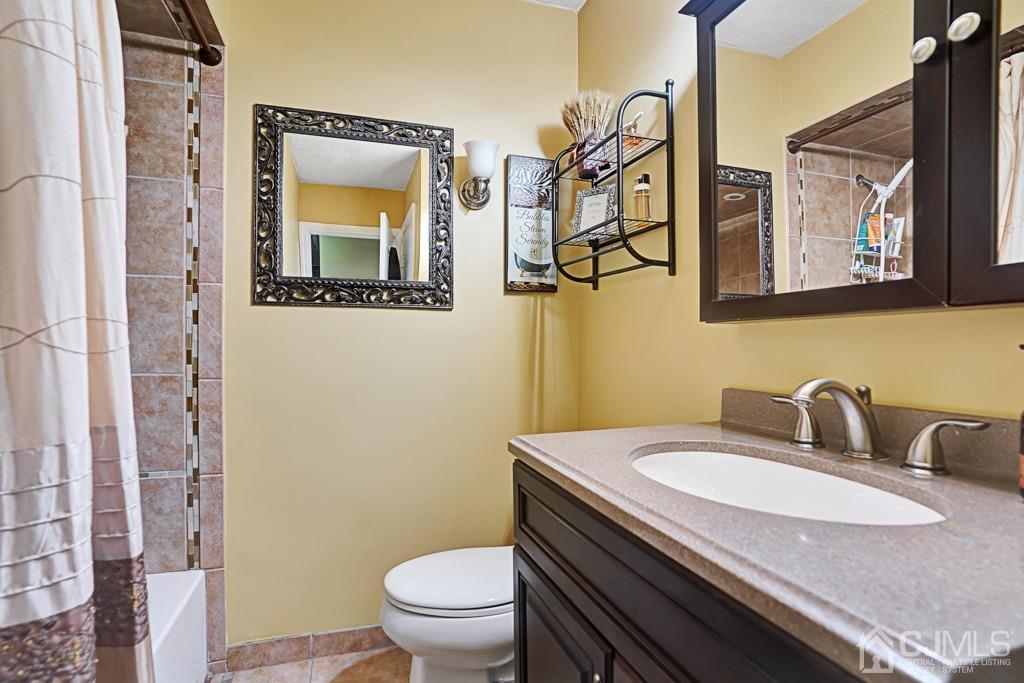 3 Blue Ridge Avenue Green Brook, NJ 08812 - Photo 17 of 30 a bathroom with a toilet sink and mirror