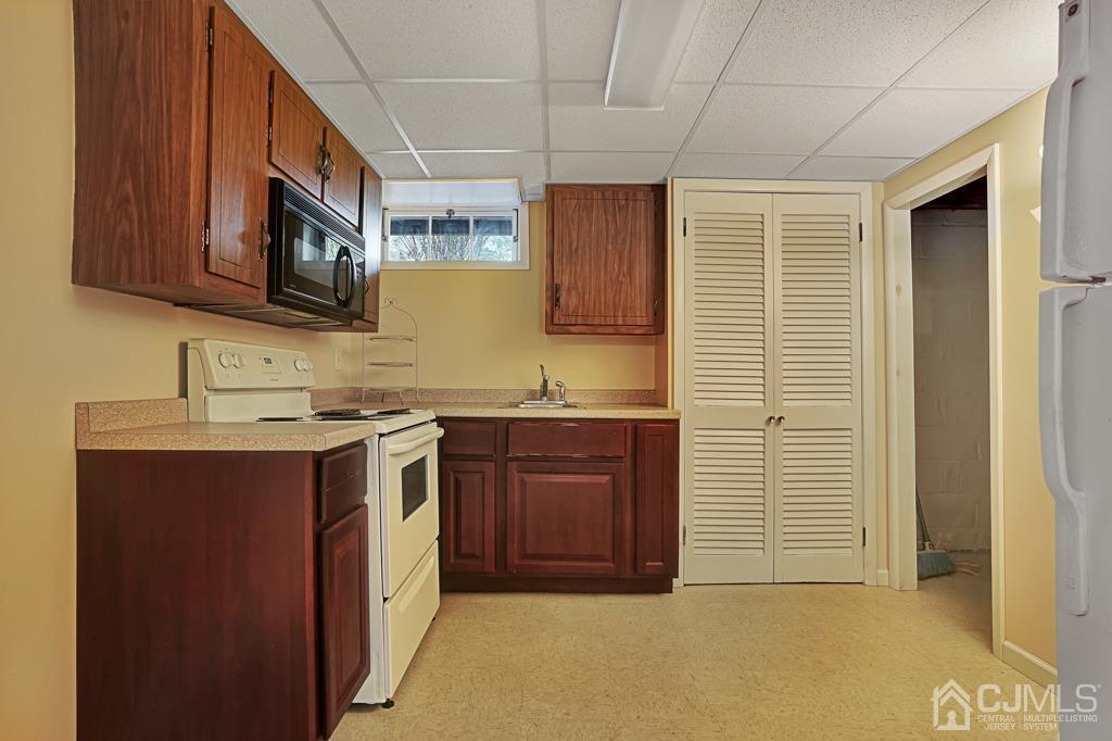 3 Blue Ridge Avenue Green Brook, NJ 08812 - Photo 20 of 30 a kitchen with stainless steel appliances granite countertop a stove a sink and a microwave