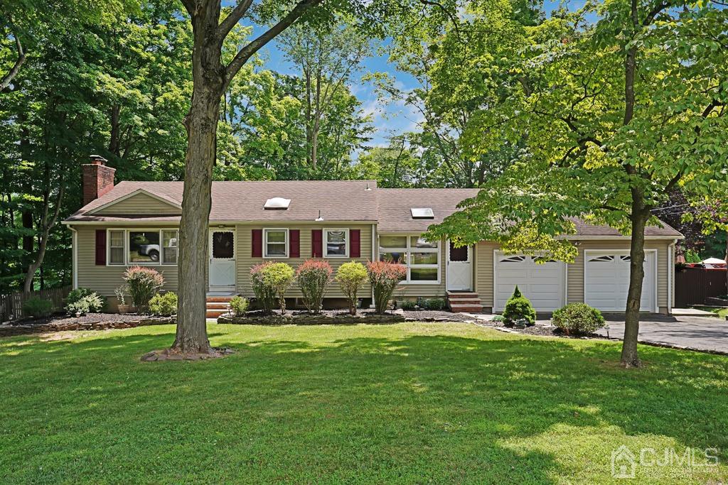 3 Blue Ridge Avenue Green Brook, NJ 08812 - Photo 30 of 30 a front view of a house with a yard table and chairs