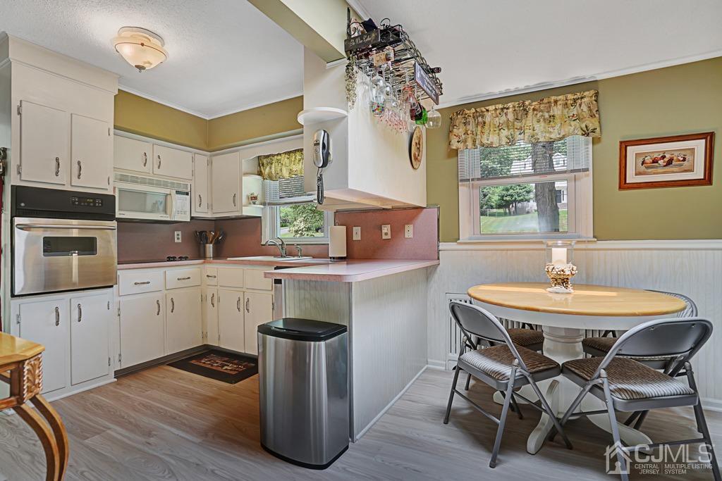 3 Blue Ridge Avenue Green Brook, NJ 08812 - Photo 4 of 30 a kitchen with granite countertop white cabinets and wooden floor