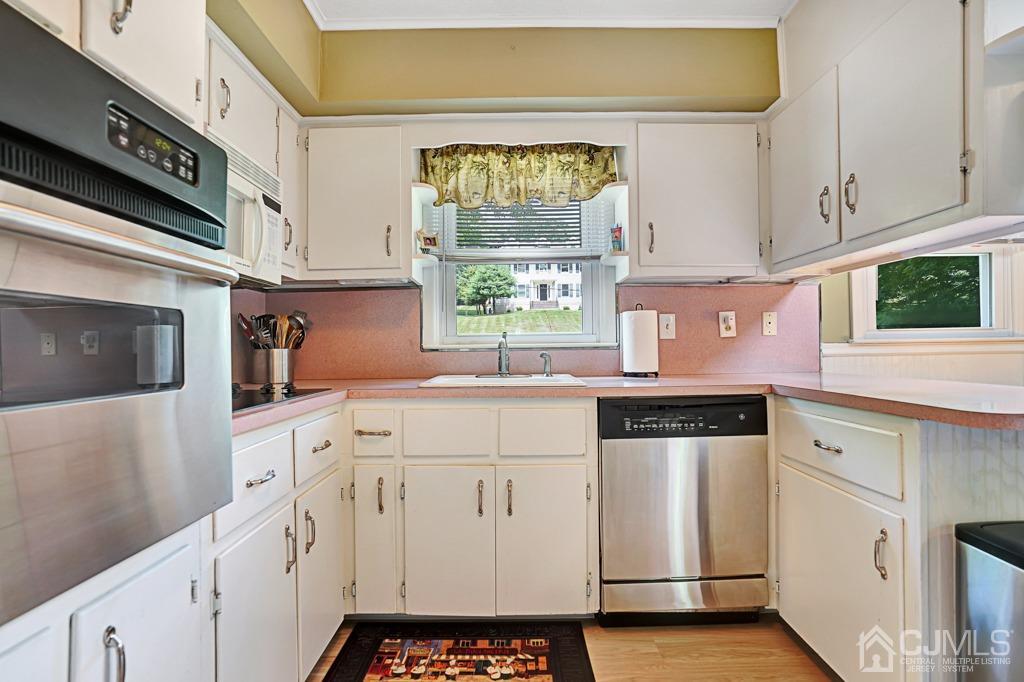 3 Blue Ridge Avenue Green Brook, NJ 08812 - Photo 8 of 30 a kitchen with white cabinets and white appliances