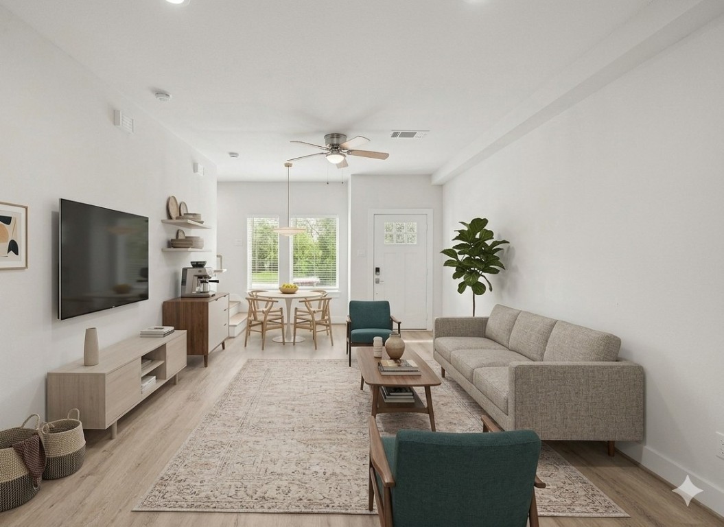 4007 New Orleans Street, Unit B Houston, TX 77020 - Photo 4 of 20 a living room with furniture and a flat screen tv