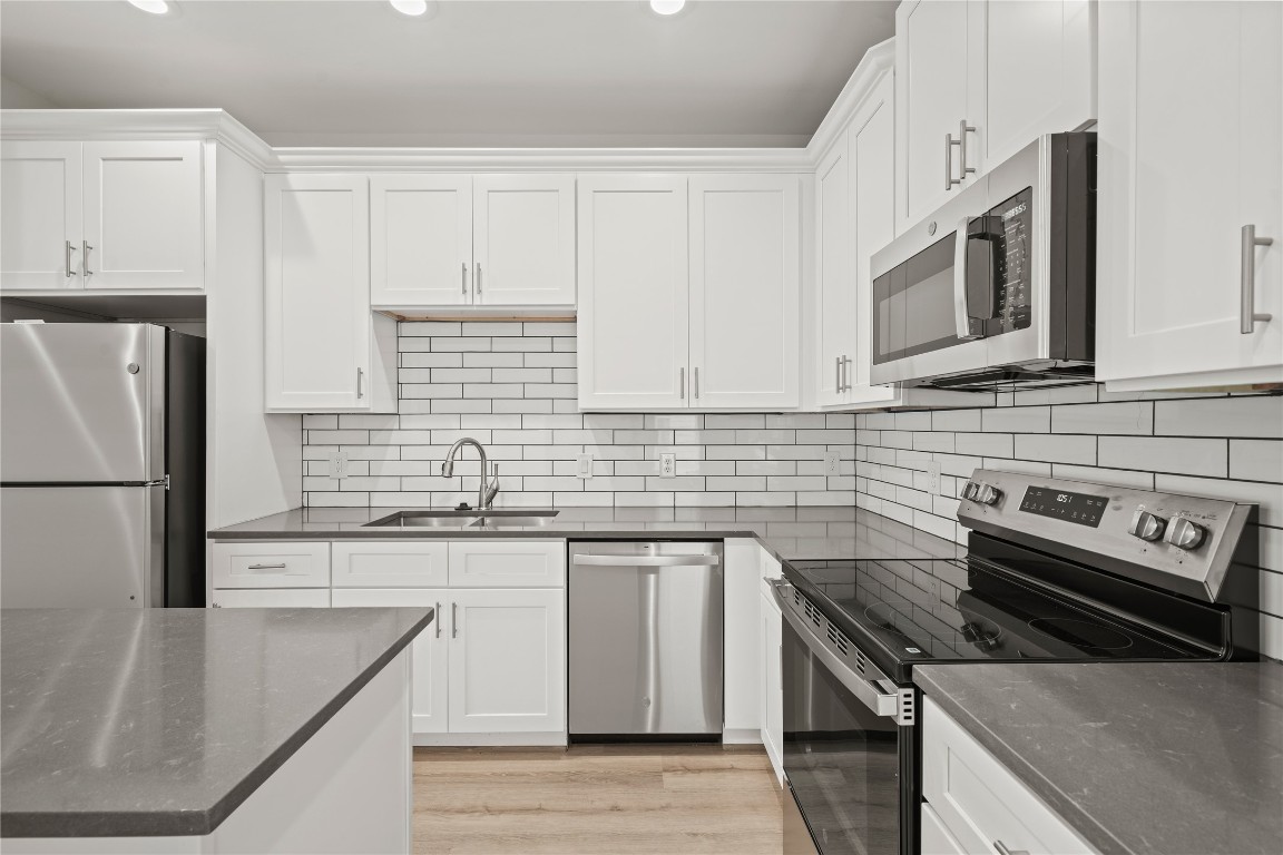 4007 New Orleans Street, Unit B Houston, TX 77020 - Photo 6 of 20 a kitchen with stainless steel appliances granite countertop a sink stove and refrigerator