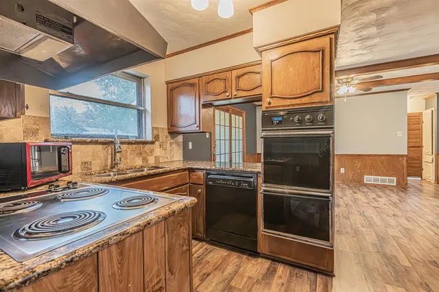 a kitchen with a stove and a microwave