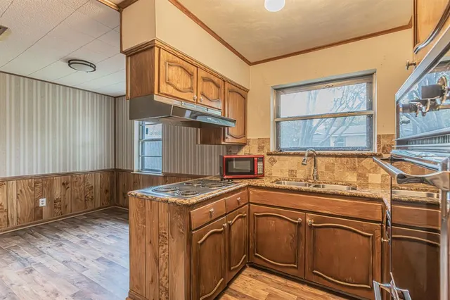 a utility room with a sink dryer and washer