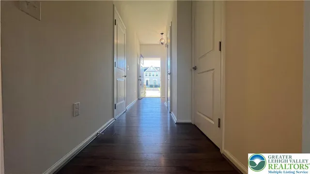 a view of a hallway with the wooden floor