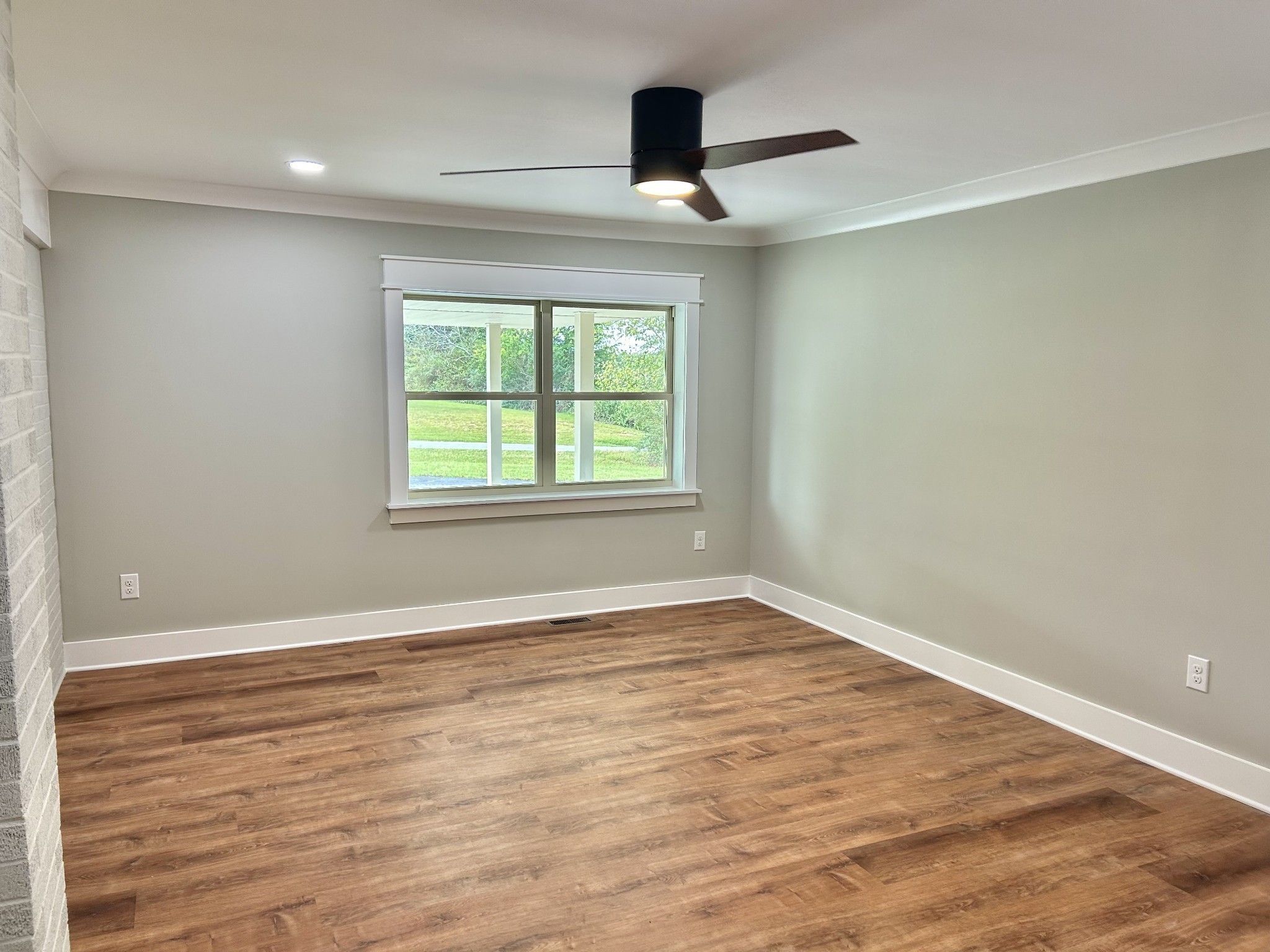 3786 Gnat Hill Road Manchester, TN 37355 - Photo 24 of 71 a view of an empty room with wooden floor and a window