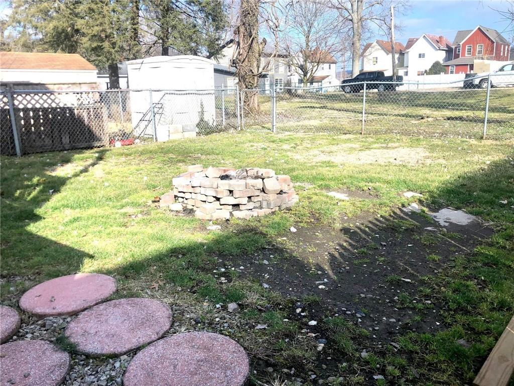 411 Locust Street Elizabeth, PA 15037 - Photo 20 of 22 a view of swimming pool with a yard and plants