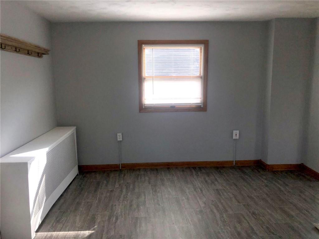411 Locust Street Elizabeth, PA 15037 - Photo 7 of 22 an empty room with wooden floor and windows