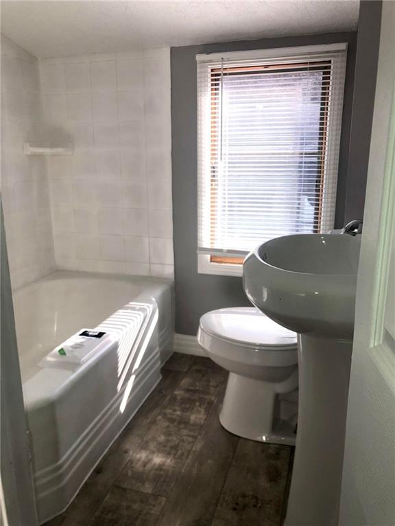 411 Locust Street Elizabeth, PA 15037 - Photo 10 of 22 a bathroom with a sink toilet and window