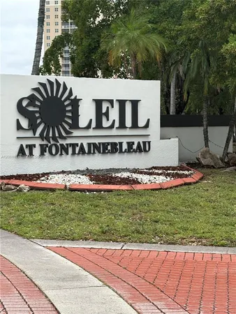 a view of a park with welcome board