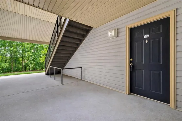a view of a patio with table and chairs