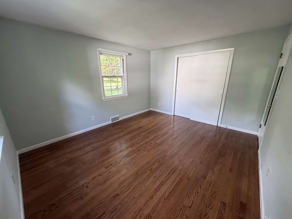 74 Birch Road Longmeadow, MA 01106 - Photo 12 of 38 an empty room with wooden floor and windows