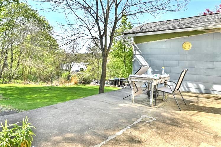 9561 Harding Road Pittsburgh, PA 15237 - Photo 8 of 9 a view of a yard with table and chairs