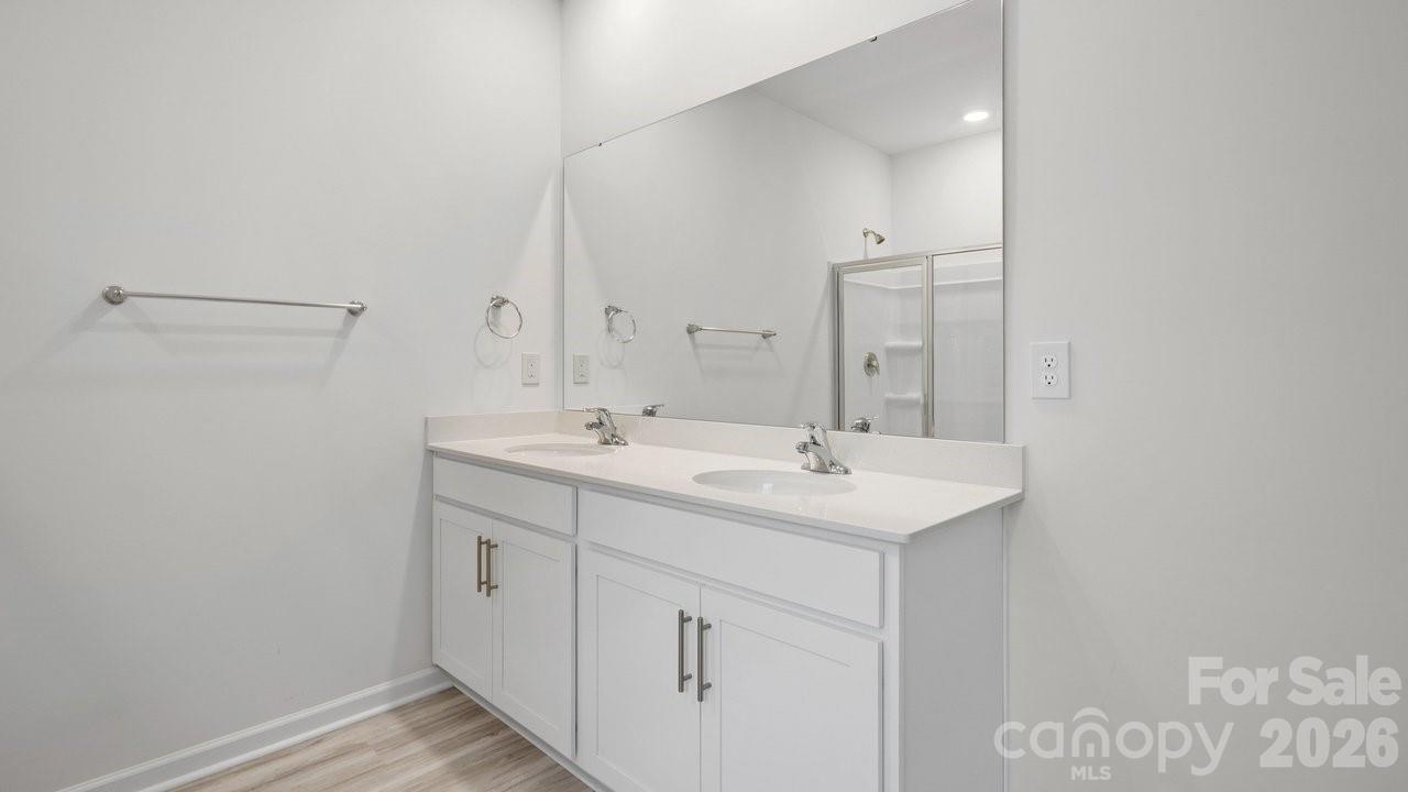 3688 Mercer Street Terrell, NC 28682 - Photo 34 of 34 a bathroom with a sink and a mirror