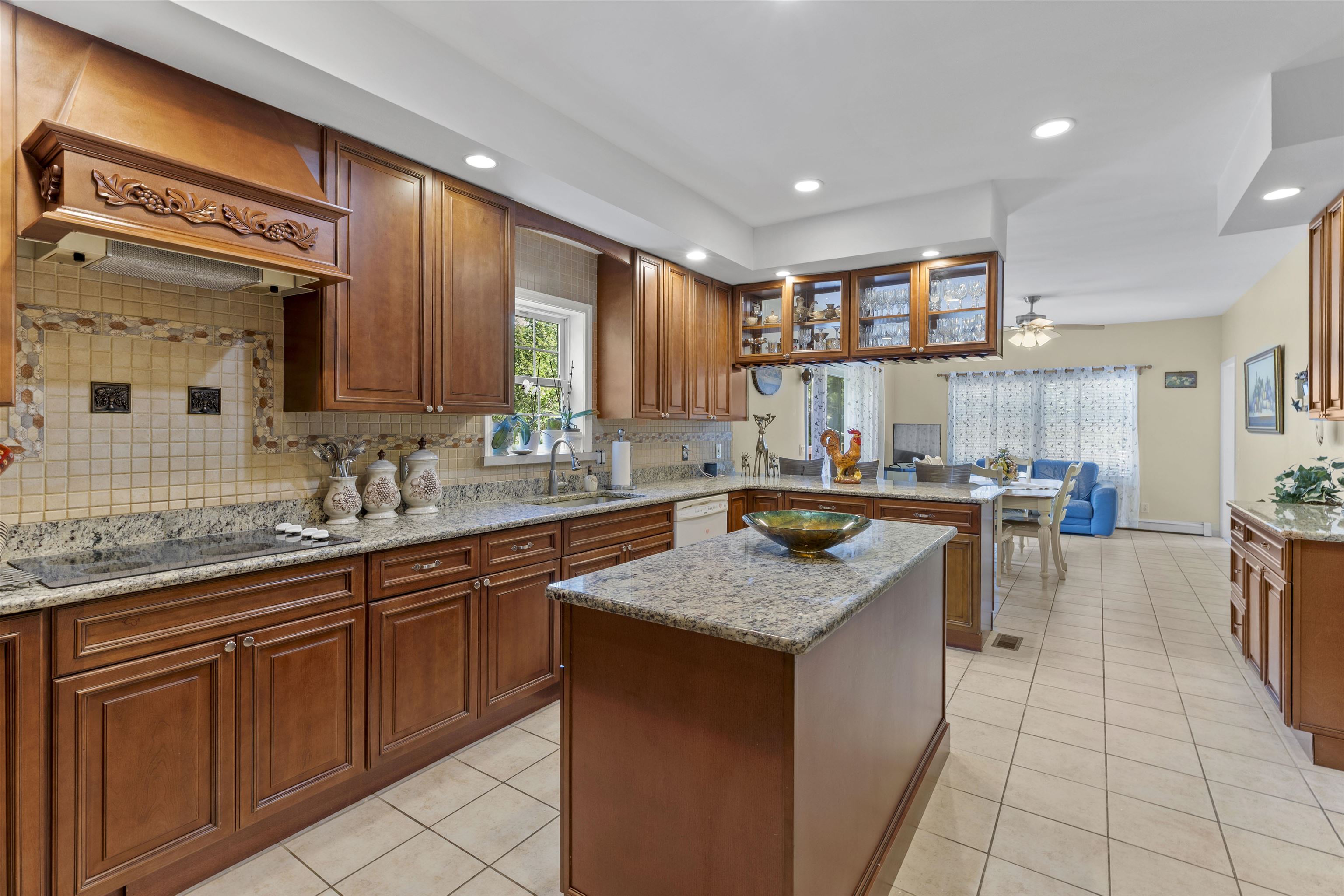 551 Shunpike Road Cape May Court House, NJ 08210 - Photo 6 of 47 a kitchen with stainless steel appliances granite countertop a sink counter space cabinets and a large window
