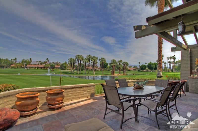 332 Red River Road Palm Desert, CA 92211 - Photo 1 of 40 a view of a chairs and table in patio with a yard