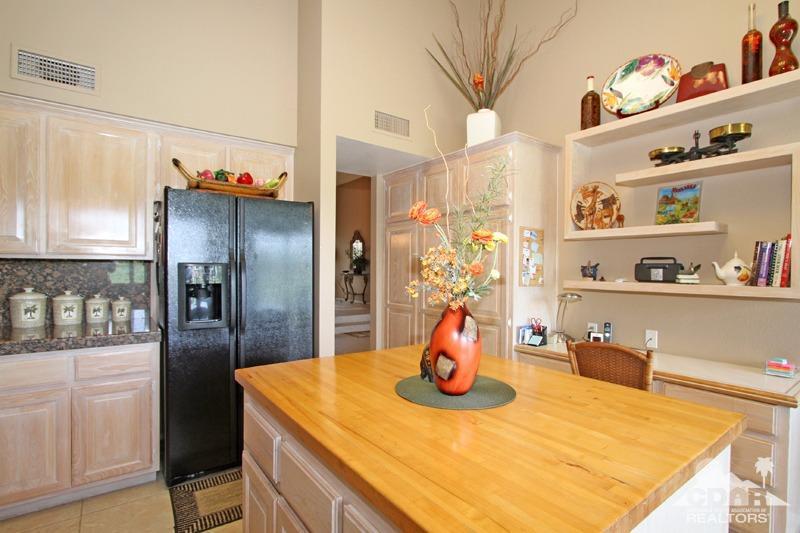 332 Red River Road Palm Desert, CA 92211 - Photo 17 of 40 a kitchen with a refrigerator and microwave