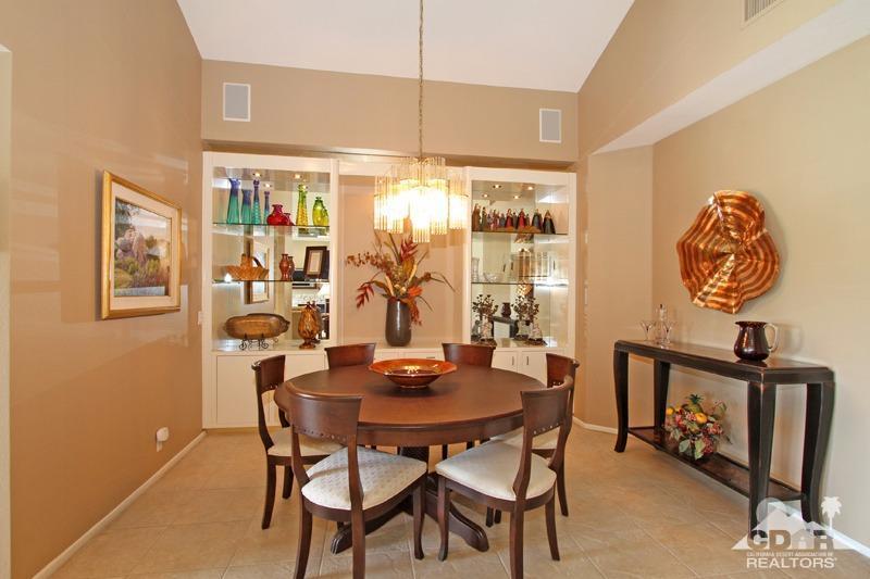 332 Red River Road Palm Desert, CA 92211 - Photo 18 of 40 a view of a dining room with furniture and chandelier