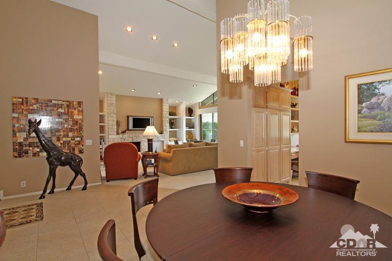 332 Red River Road Palm Desert, CA 92211 - Photo 19 of 40 a living room with furniture and a chandelier